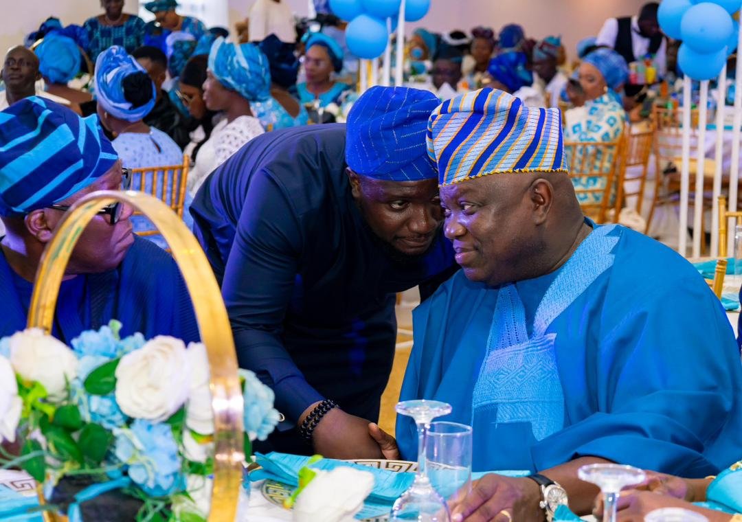 Abayomi engaging a guest at a social event