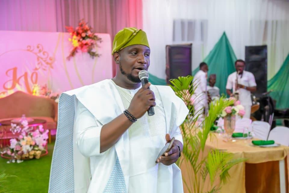 Abayomi hosting a traditional social event